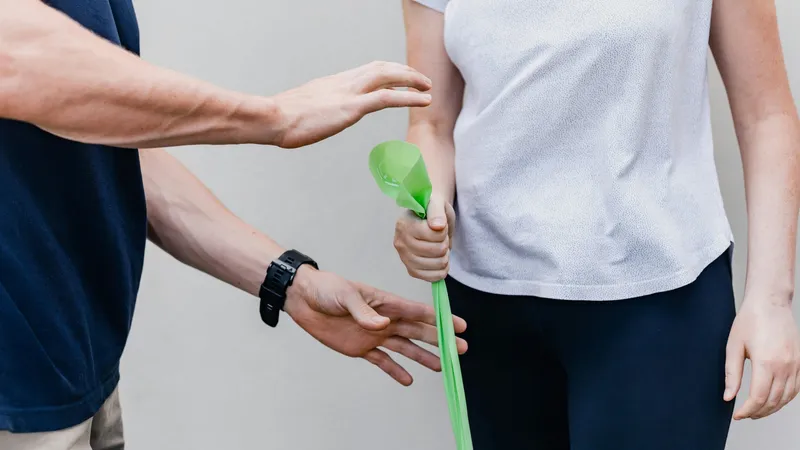 Expert physiotherapist guiding a patient through pain management and mobility exercises