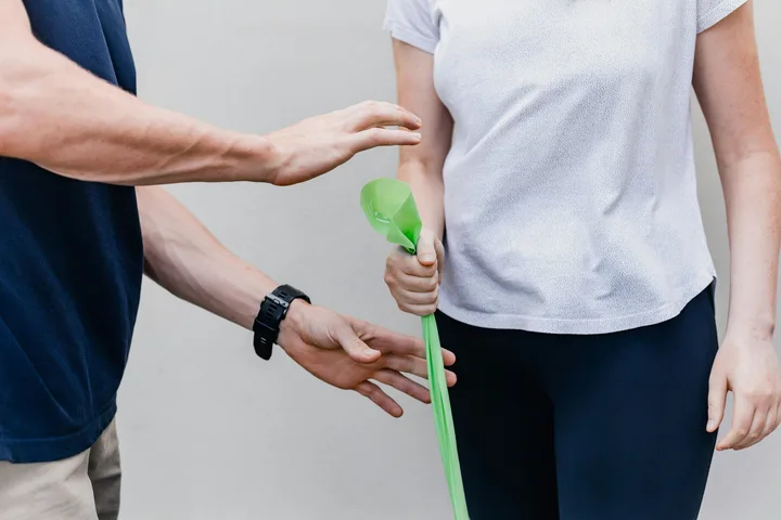 Expert physiotherapist guiding a patient through pain management and mobility exercises