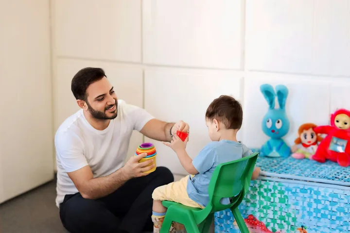 Occupational therapist engaging a client in skill-building activities for functional independence