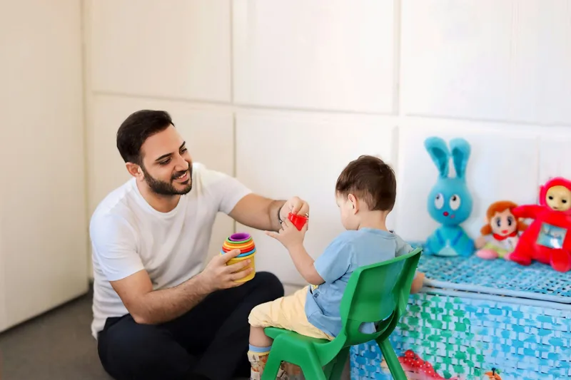 Occupational therapist assisting a patient in a supportive rehabilitation session